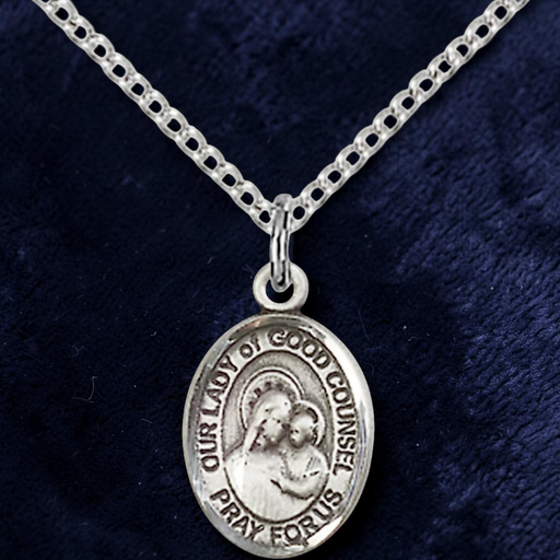 Silver necklace with a pendant on a dark blue background