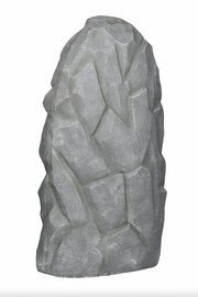 Gray stone sculpture back of an outdoor statue on a white background