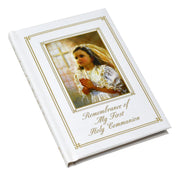 Booklet for First Holy Communion with a young girl holding a cross on the cover