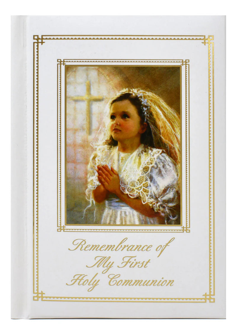 Card with a young girl in a white dress and veil, holding a heart, with text 'Remembrance of My First Holy Communion' on a white background.