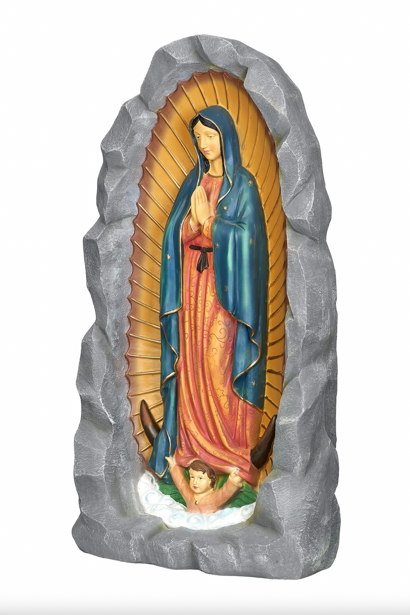 Statue of Our Lady of Guadalupe in a rocky frame on a white background