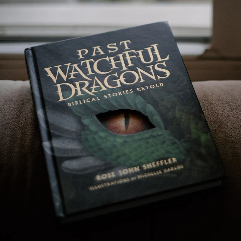 Book titled 'Past Watchful Dragons' on a surface with a blurred background