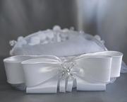 A vintage style, pearl beaded First Communion veil with a headband.