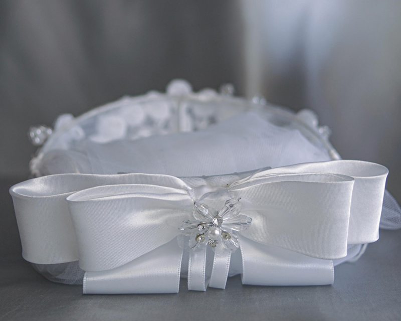 A vintage style, pearl beaded First Communion veil with a headband.