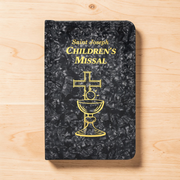 Saint Joseph Children's Missal on a wooden surface