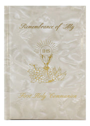 Memorial book for First Holy Communion with gold text and design on a white background