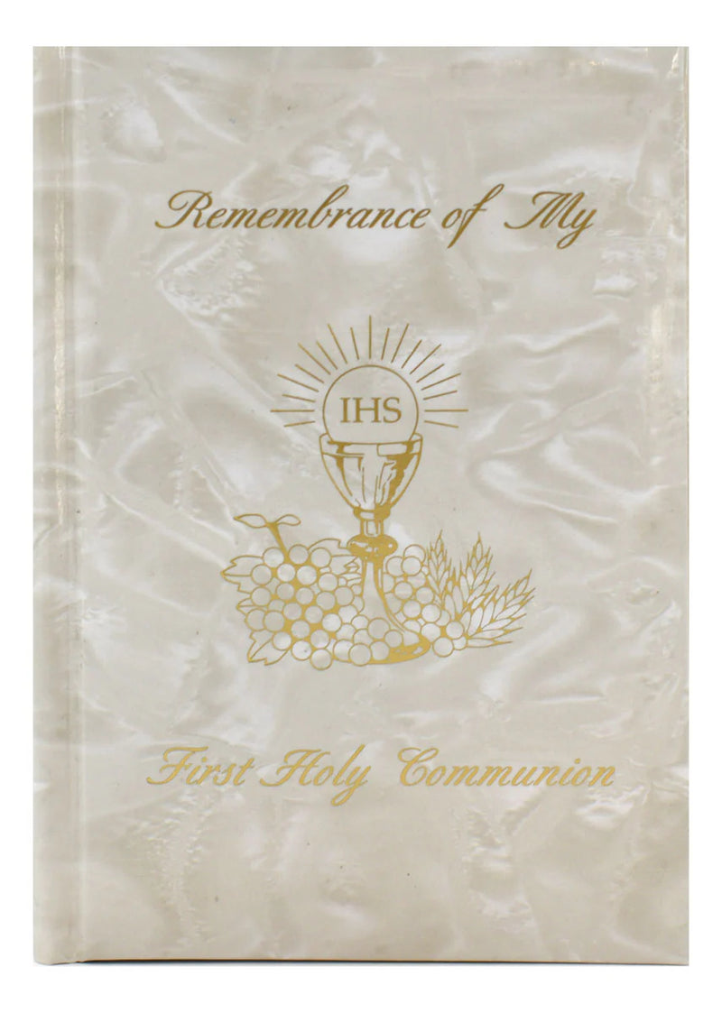 Memorial book for First Holy Communion with gold text and design on a white background