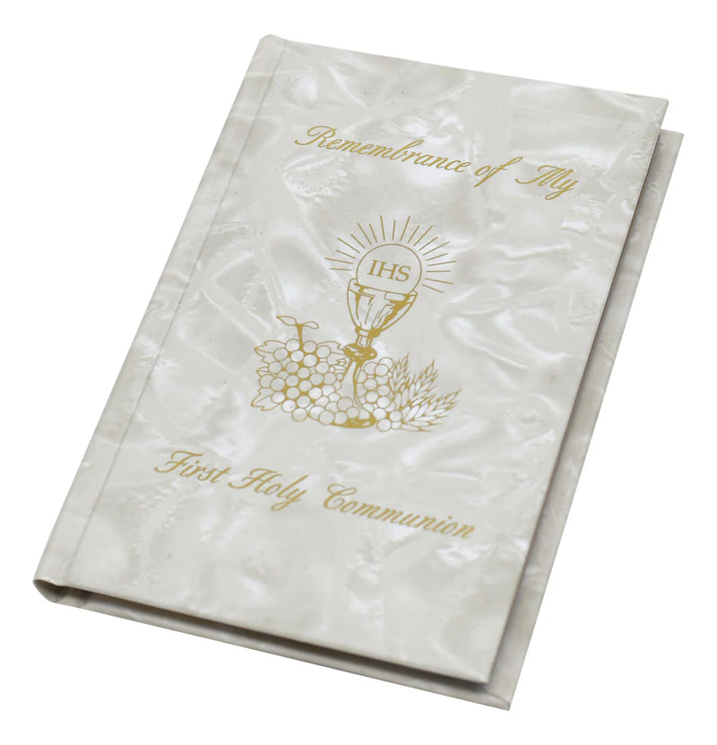 White book with gold text and design, likely for a religious ceremony, on a white background
