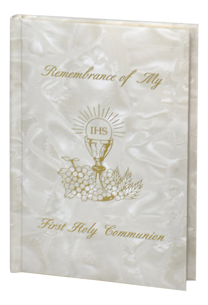White album with gold text and design for First Holy Communion