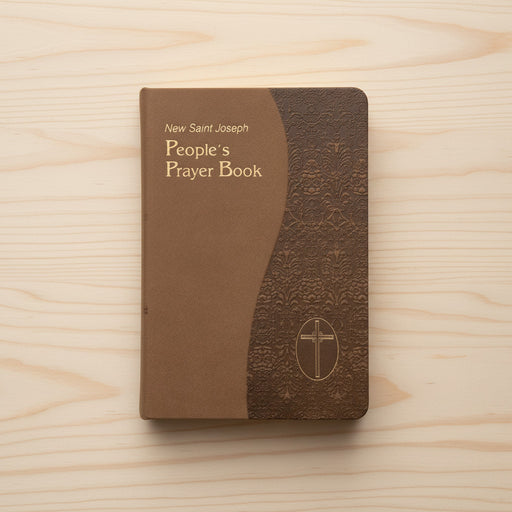 Brown prayer book with gold edges and a cross emblem on a white background