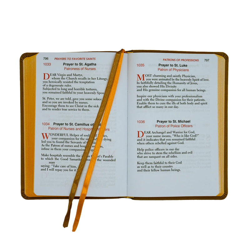 Open book with prayer text and a pen on a white background