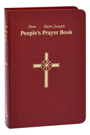 Red prayer book with gold text and cross design on a white background