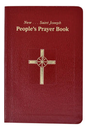 Red prayer book with gold cross and text on a white background