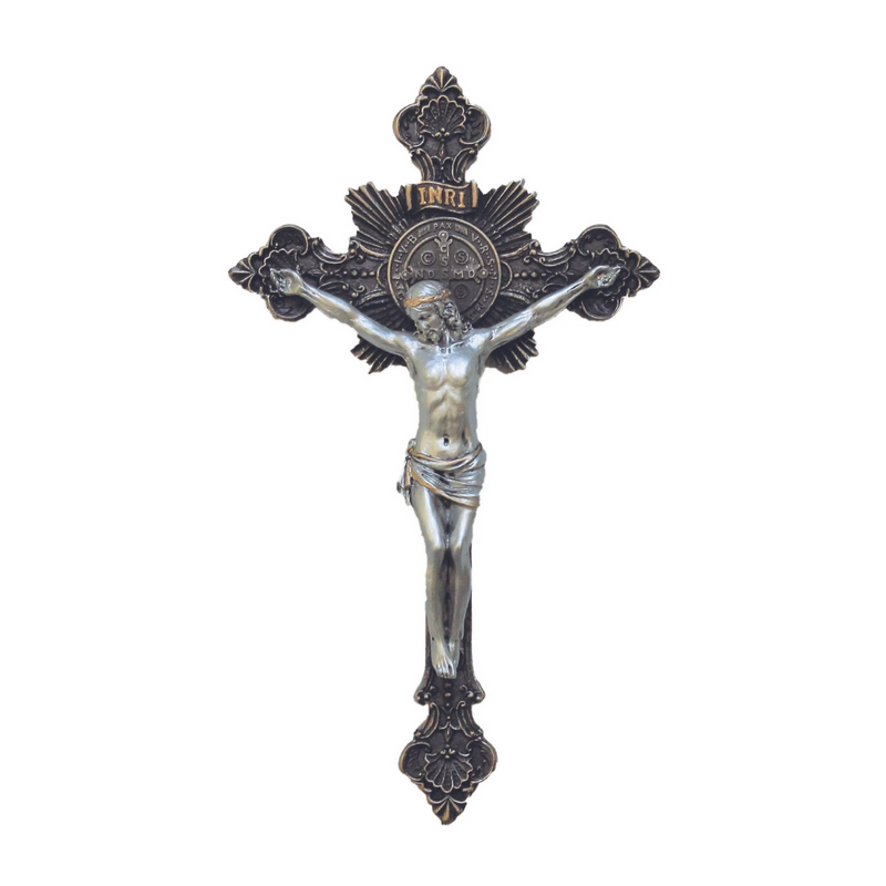 Decorative crucifix with intricate details on a white background