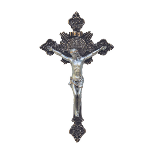 Decorative crucifix with intricate details on a white background