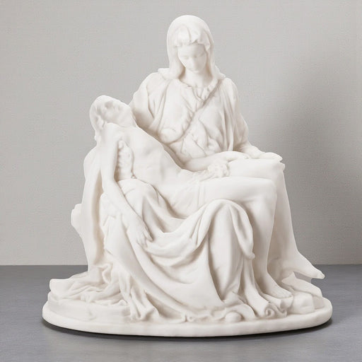 White marble sculpture of the Pieta on a gray background