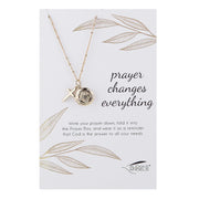Necklace with pendant on a card with 'prayer changes everything' text, featuring Texas Angels brand.