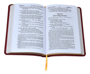 Open book with red binding on a white background