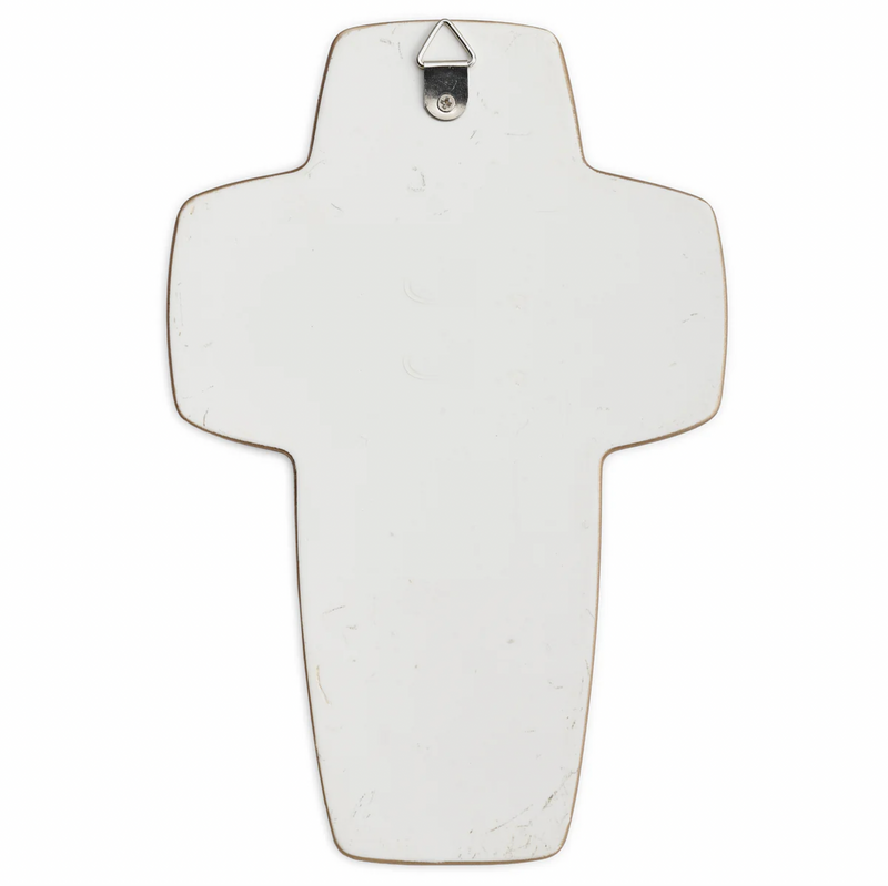 Decorative cross with a silver hook on a white background