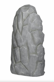 Rear view of a gray stone sculpture on a white background