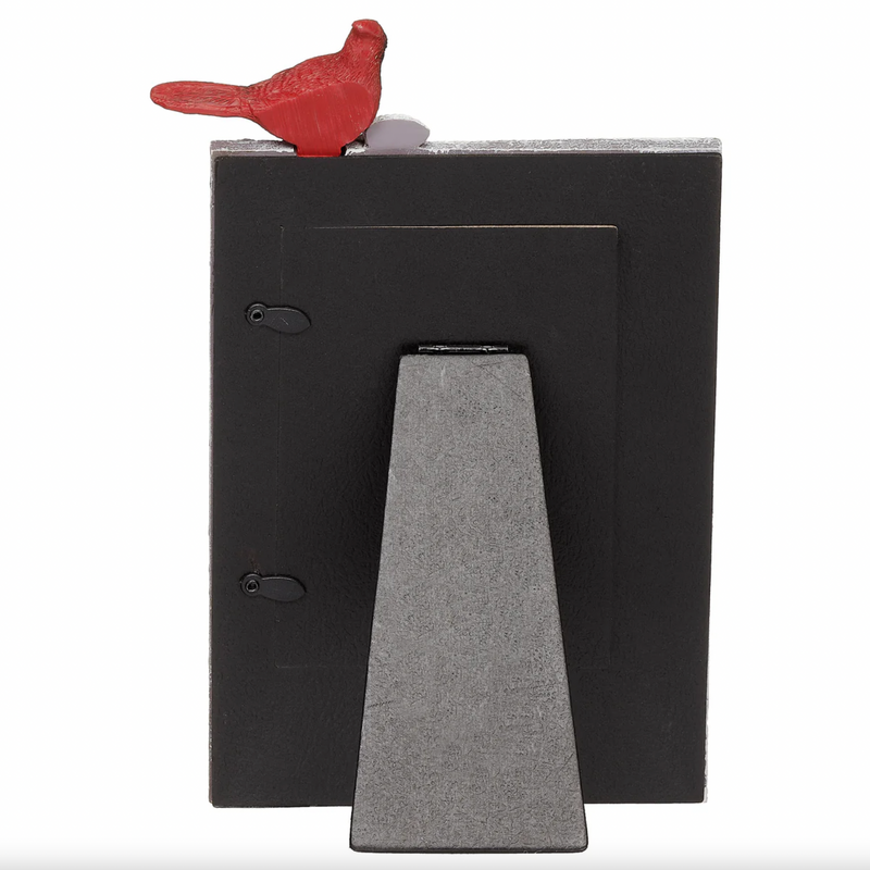 Black and gray rear view of memorial cardinal picture frame against a white background