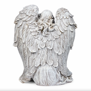 Statue of an angel with detailed wings on a white background