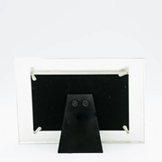Rear view of a white and silver First Communion picture frame for a 4x6 inch size photo on a white background.