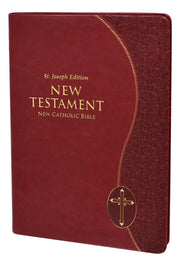 Red leather-bound New Testament with gold text and cross emblem on a white background