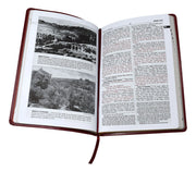 Open book with text and black and white photographs on a white background
