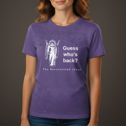 Person wearing a purple t-shirt with a resurrected Jesus graphic and text on a dark background