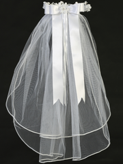 Rear view of rhinestone floral details and satin ribbon on a little girl's white sheer First Communion veil