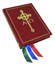 Red book with gold emblem and colored ribbons on a white background