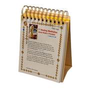Desk calendar with religious text and images on a white background