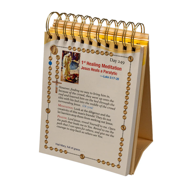 Desk calendar with religious text and images on a white background