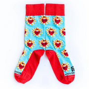 A pair of adult-sized socks with a design of the Sacred Heart of Jesus, predominantly red with blue and yellow accents.