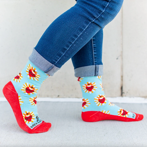 A pair of adult-sized socks with a design of the Sacred Heart of Jesus, predominantly red with blue and yellow accents.