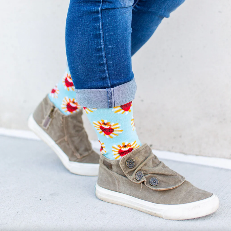 A pair of adult-sized socks with a design of the Sacred Heart of Jesus, predominantly red with blue and yellow accents.