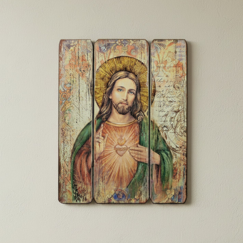 Triptych wall art of the Sacred Heart of Jesus on a wooden panel.