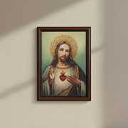 Framed artwork of a religious figure holding a heart on a beige wall.