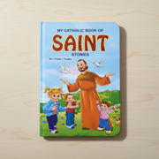 Book titled 'My Catholic Book of Saint Stories' on a wooden surface