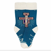 A pair of blue socks with a white San Damiano cross, design on a white background