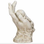 Statue of a hand holding a child on a white background