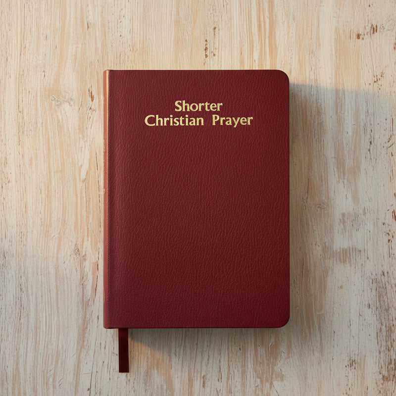 Red book titled 'Shorter Christian Prayer' on a wooden surface
