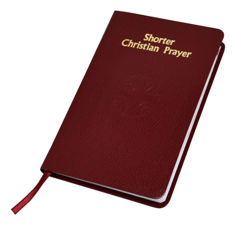 Maroon prayer book titled 'Shorter Christian Prayer' on a white background