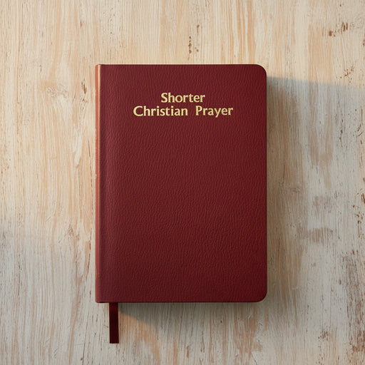 Red book titled 'Shorter Christian Prayer' on a wooden surface