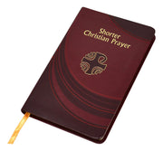 Maroon prayer book with gold text and cross symbol on a white background