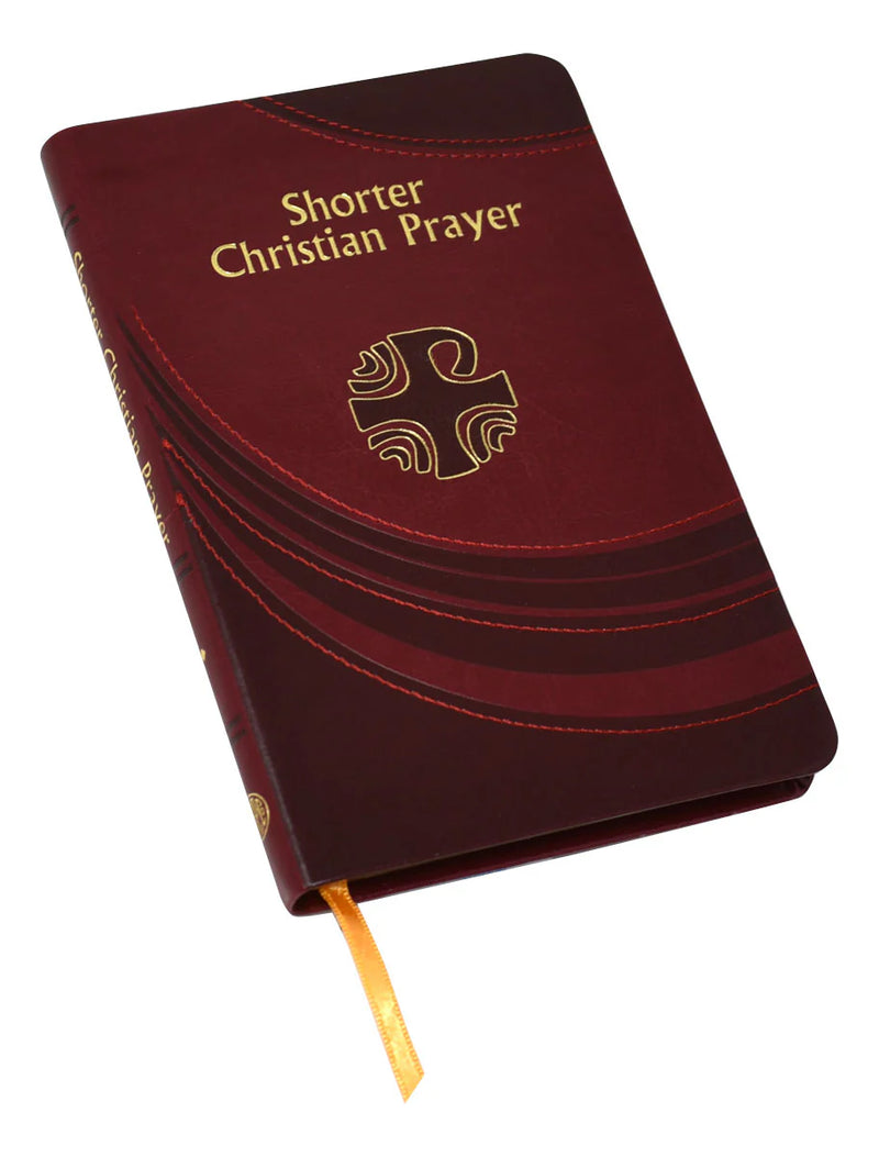 Maroon prayer book with gold text and cross emblem on a white background