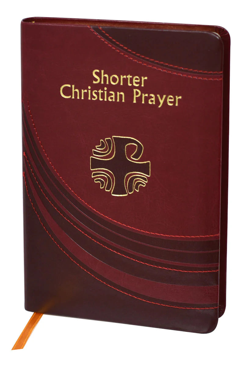 Maroon prayer book with gold text and cross symbol on a white background