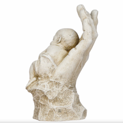 Serene statue of a hand holding a baby on a white background