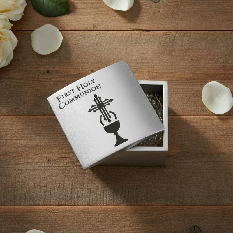 Silver First Holy Communion jewelry box on a wood surface